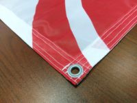 flaga mesh zaoczkowana - druk tanich banerów tekstylnych